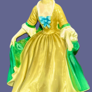 Elegant yellow and green historical dress with blue floral details.
