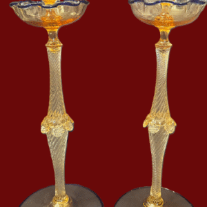 Two ornate decorative glass goblets with intricate gold designs.