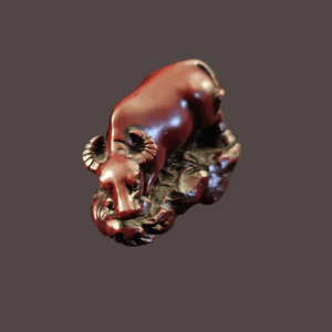 A shiny brown hippopotamus figurine on a textured base.