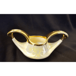 Elegant vintage porcelain bowl with gold handles and delicate floral design.