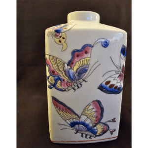 Rectangular vase decorated with colorful butterflies.