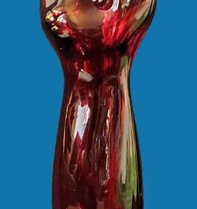 Shiny red dress with floral details on a mannequin against a blue background.