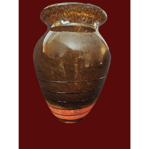 A rustic ceramic vase with earthy tones and a textured finish.
