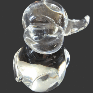 A clear glass elephant figurine with a shiny, smooth surface.