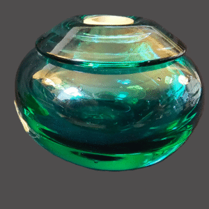 A round, teal-colored glass vase with a glossy finish.