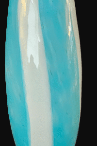 Close-up of a smooth, glossy blue and white ceramic vase.