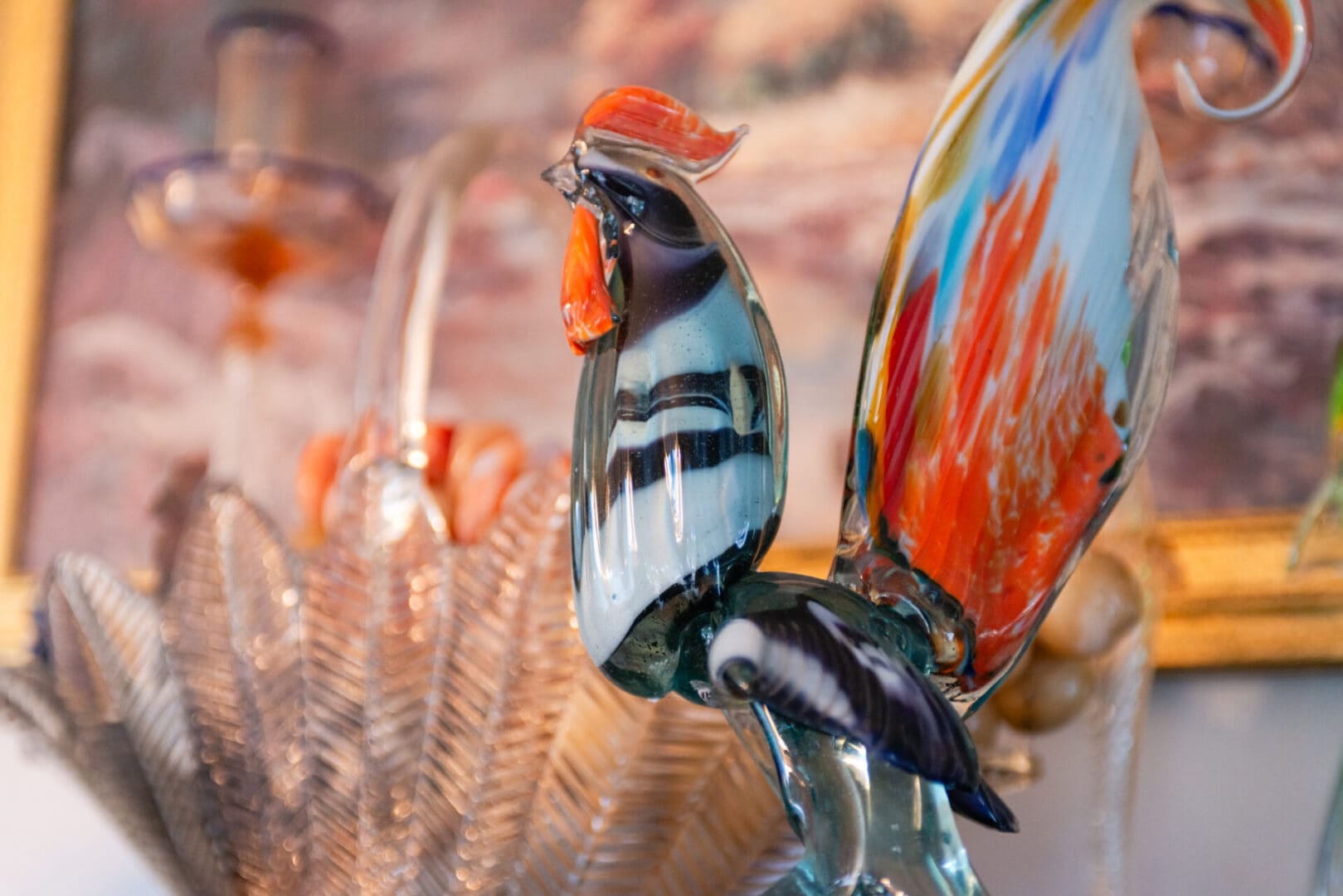 A colorful peacock mantis shrimp with vibrant blue, orange, and green hues.