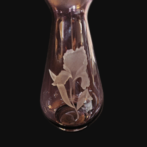 A glass bulb with a delicate flower inside, glowing softly.