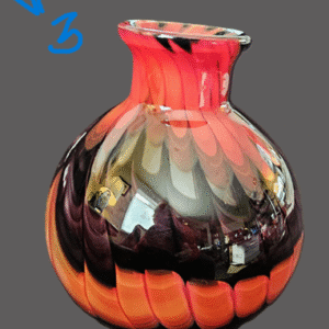 Colorful glass vase with a wavy, twisted design.