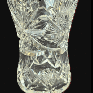 A detailed crystal vase with intricate geometric patterns.