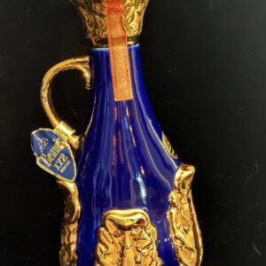 Elegant blue and gold decorative pitcher with intricate design.