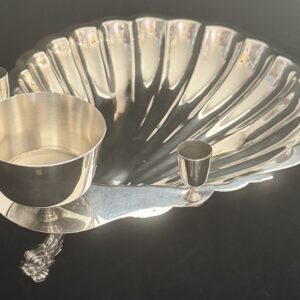 Elegant silver serving tray with matching bowl, knife, and small cup.